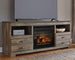Trinell - 63" TV Stand With Glass/Stone Fireplace Insert - Brown