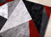 Platinum Red Grey Black Triangles Rug - Furniture Depot