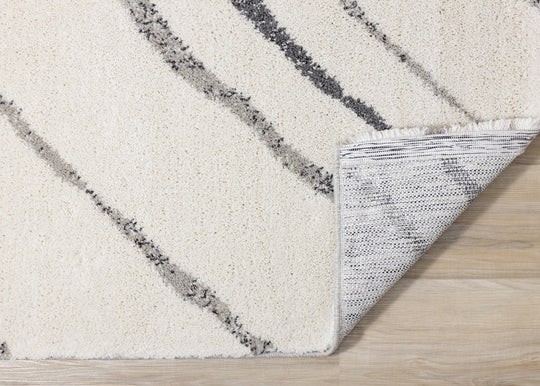 Ravine Cream Grey Wishbone Shag Rug - Furniture Depot