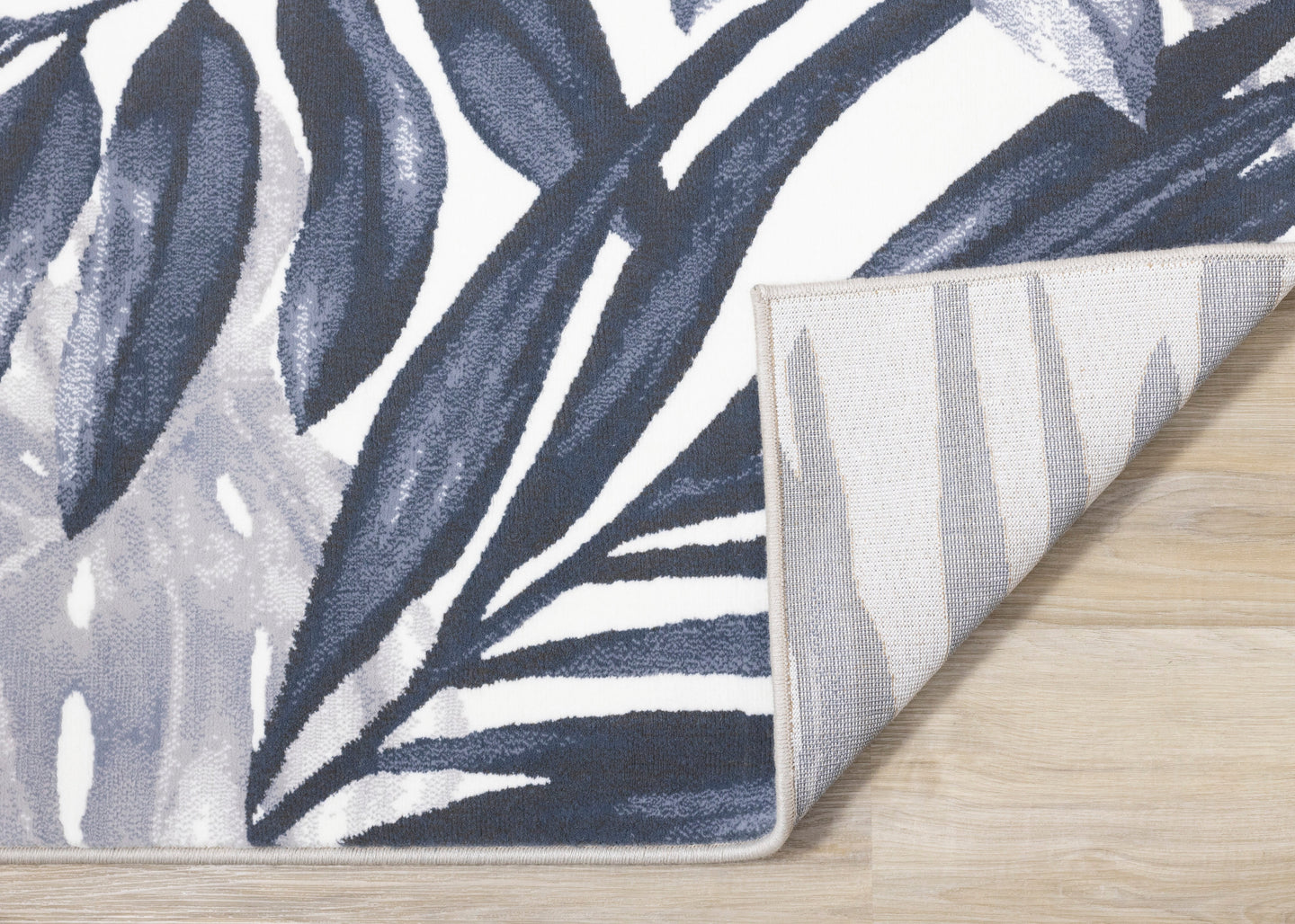 Intrigue Blue White Palm Fronds Plush Rug - Furniture Depot