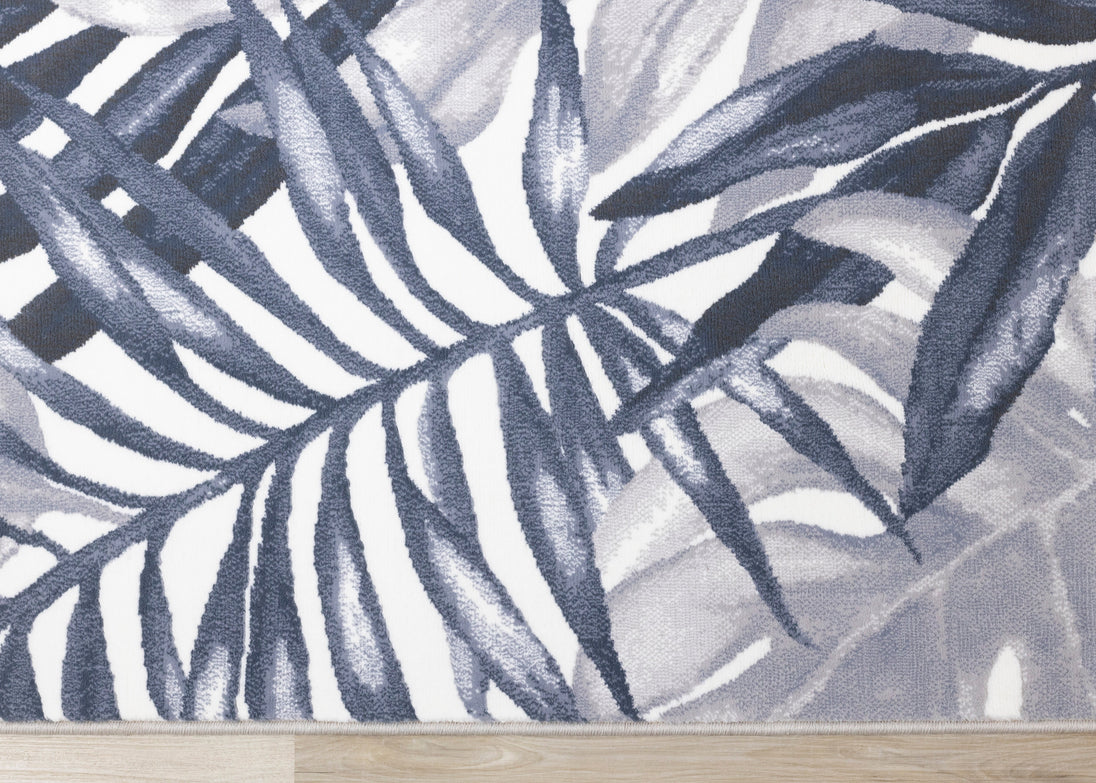 Intrigue Blue White Palm Fronds Plush Rug - Furniture Depot