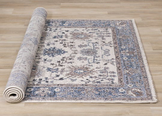 Safi Cream Pink Blue Faded Floral Border Rug - Furniture Depot